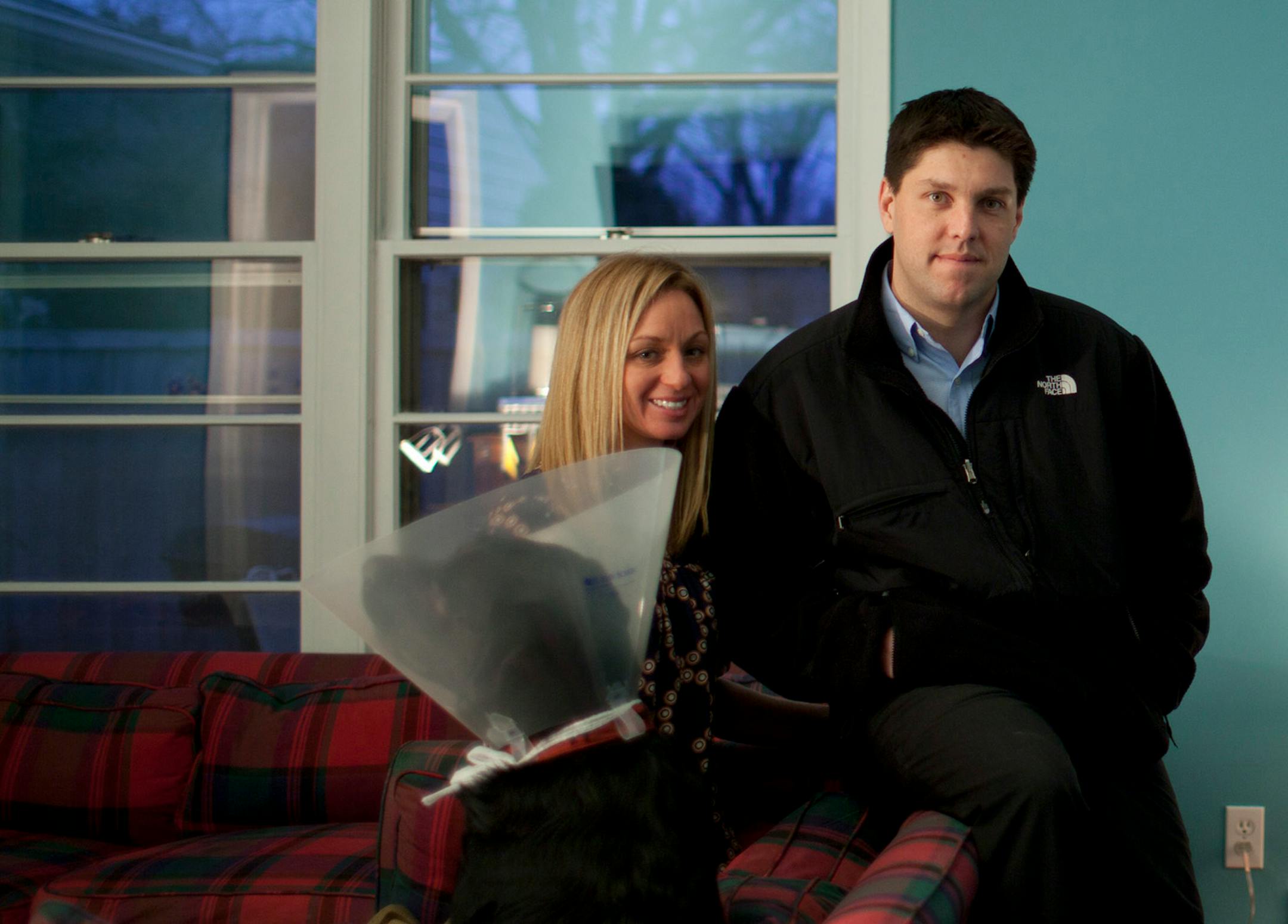 Scott and K.K. Strand (pictured in this February file photo with their dog, Ike) bought a modest Edina rambler in November for $262,000. A month later, they got a city notice that they would have to pay $16,800 for street reconstruction.