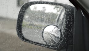 iStockphoto.com
The view from a motor vehicle side mirror through the window in the rain. The image layers up due to the blind spot mirror giving a di