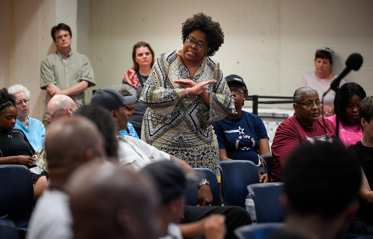 A woman, who would not give her name, spoke at Friday night's community conversation at the Hallie Q. Brown Community Center in the wake of the acquittal of St. Anthony police officer Jeronimo Yanez. ] AARON LAVINSKY &#xef; aaron.lavinsky@startribune.com Reactions at the site of where Philando Castile was shot in Falcon Heights photographed Friday, June 16, 2017.