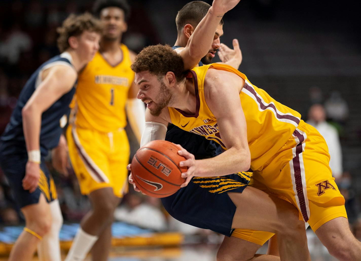 Minnesota Gophers forward Jamison Battle (10) was fouled as he drove into Concordia Golden Bears forward Matt Johns (32) in the second half Monday, Nov. 1, 2021 in Minneapolis. The University of Minnesota Gophers men's basketball team opened their season with an 80-67 exhibition game win against the Concordia-St. Paul Bears at Williams Arena Monday night, Monday, Nov. 1, 2021 in Minneapolis. ] JEFF WHEELER • Jeff.Wheeler@startribune.com