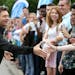 Hundreds of "American Idol" fans cheered as Ryan Seacrest, arrived for the kickoff its auditions for it's 14th Anniversary Show outside Mariucci Arena