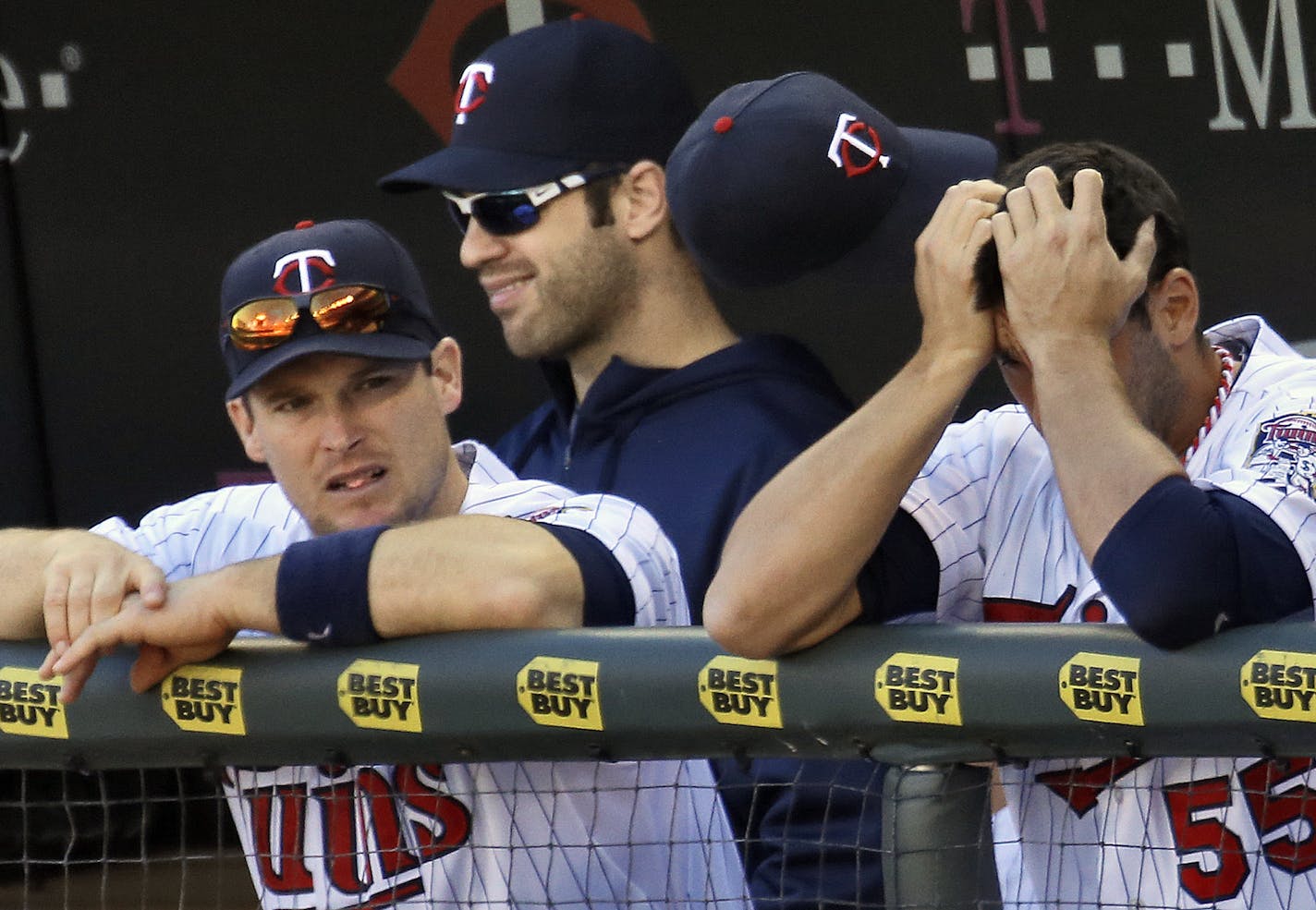 Twins vs. Cleveland. Twins last game of the season, losing 5-1 to the Indians. It may have been Twins manager Ron Gardenhire's last game as manager. It was another long game for Twins Josh Willingham, Joe Mauer and Chris Colabello, l-r, as they watched the game from the dugout. (MARLIN LEVISON/STARTRIBUNE(mlevison@startribune.com)