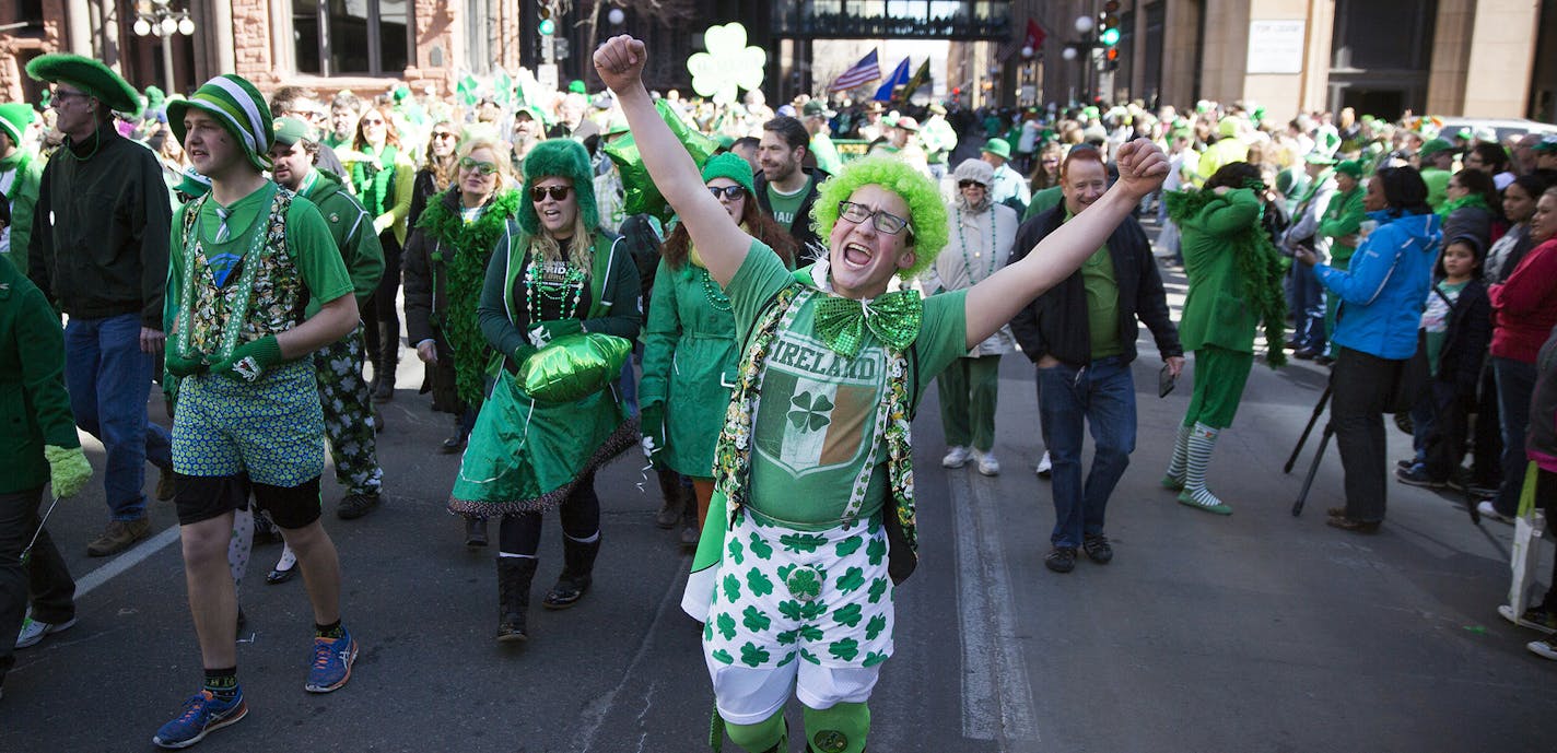 Garrett O'Keefe marches with his family during the 49th annual St. Patrick's Day parade in downtown St. Paul on Tuesday, March 17, 2015. ] LEILA NAVIDI leila.navidi@startribune.com / ORG XMIT: MIN1503171502468775