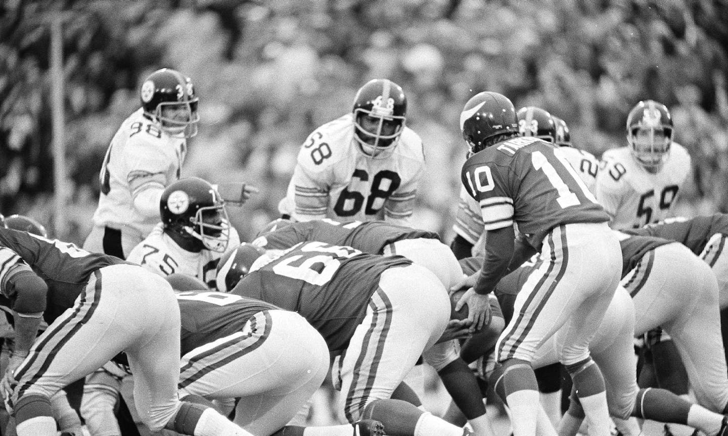 This shows the defense that Minnesota Vikings' quarterback Fran Tarkenton (10) had to face during Super Bowl IX, Jan. 12, 1975, in New Orleans. Pittsburgh Steelers are Ed Bradley (38), L.C. Greenwood (68) and Jack Ham (59), and Joe Greene (75). Steelers won, 16-6. (AP Photo/Phil Sandlin) ORG XMIT: APHS86305