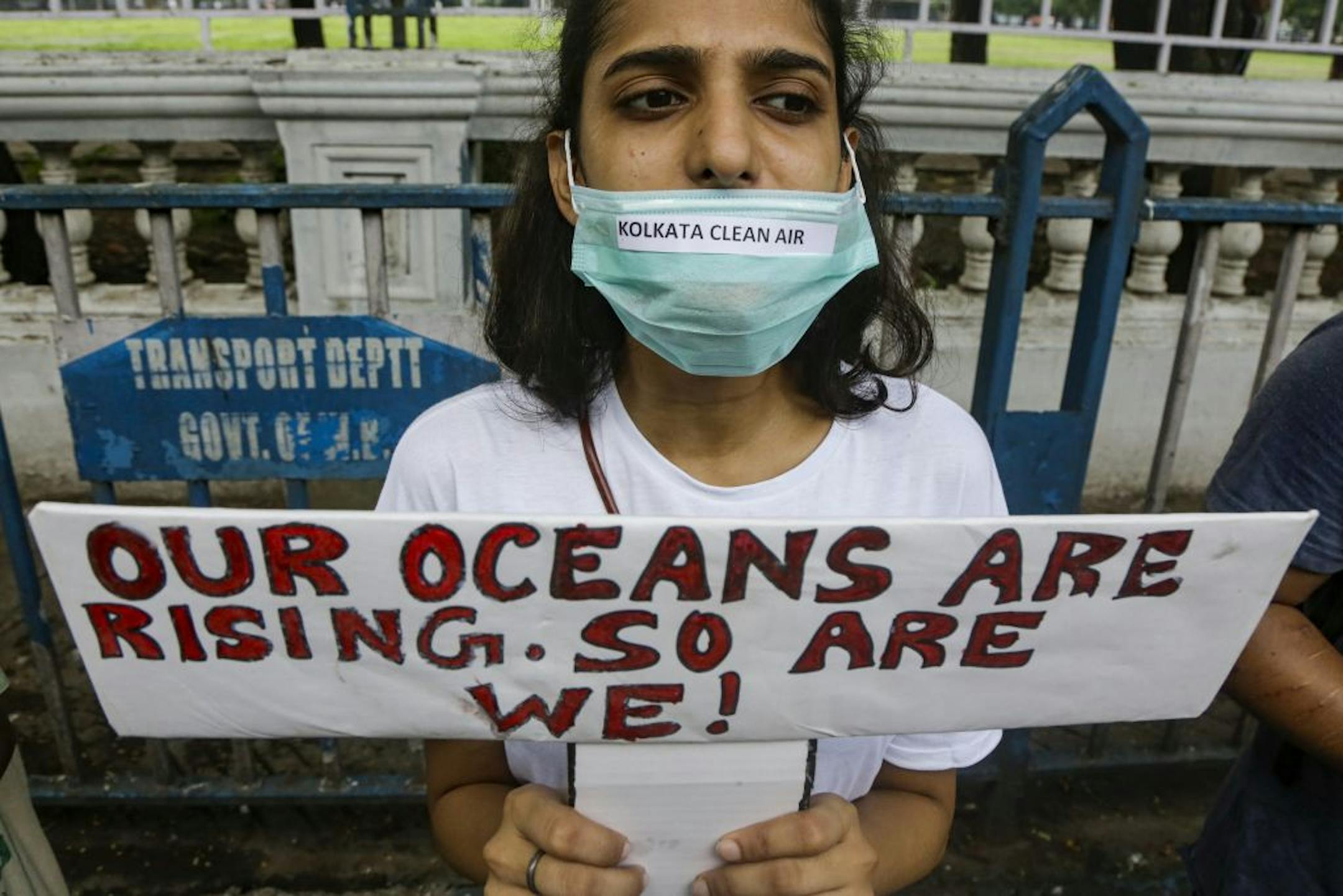 A protestor holds a placard and participates in a demonstration in Kolkata, India, Friday, Sept. 20, 2019. The protestors gathered in response to a day of worldwide demonstrations calling for action to guard against climate change began ahead a U.N. summit in New York.