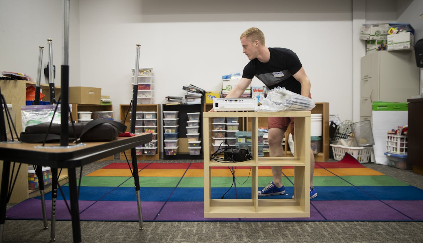 Kindergarten teacher Gus Gleiter set up his classroom on the first day back at school at Prodeo Academy in Minneapolis, Minn., on August 1, 2018. ] RENEE JONES SCHNEIDER &#x2022; renee.jones@startribune.com