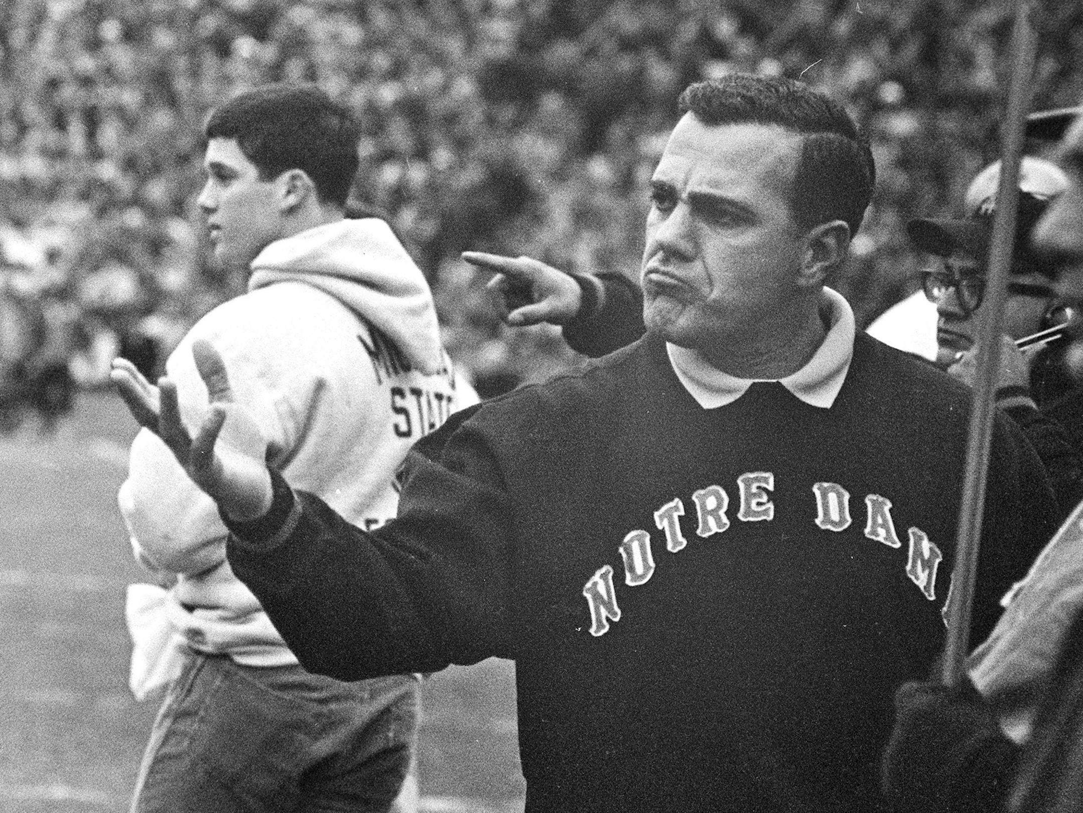 In this Nov. 19, 1966, file photo, Notre Dame coach Ara Parseghian gestures during a college football game against Michigan State, in East Lansing, Mich.