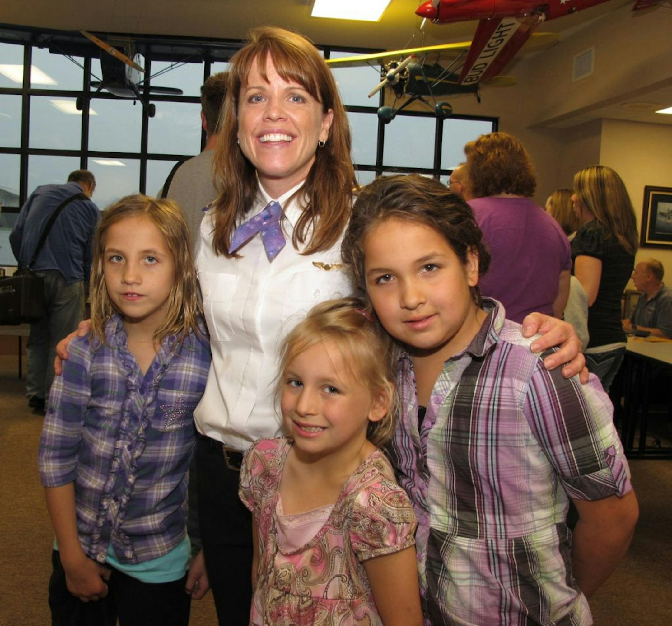 Lynda Meeks, executive director and founder of Girls With Wings, with Kaylie, Ellie and Zoe Carik.