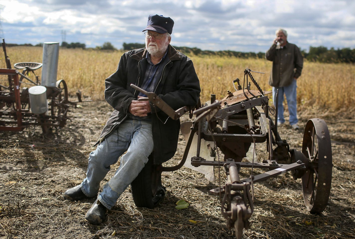 Wayne Schilling, a fifth-generation farmer in Woodbury, and his wife, Betty, auctioned off all their farm equipment and machinery Saturday, Oct. 4, 2014, in Woodbury, MN.Here, Alan Hansen of Baldwin, WI, got comfortable on an antique two-bottom plow.](DAVID JOLES/STARTRIBUNE)djoles@startribune.com Wayne Schilling, a fifth-generation farmer in Woodbury, has sold the last 130 acres of the family farm and one of the last farms in Woodbury to developers. Wayne and his wife, Betty, auctioned off all