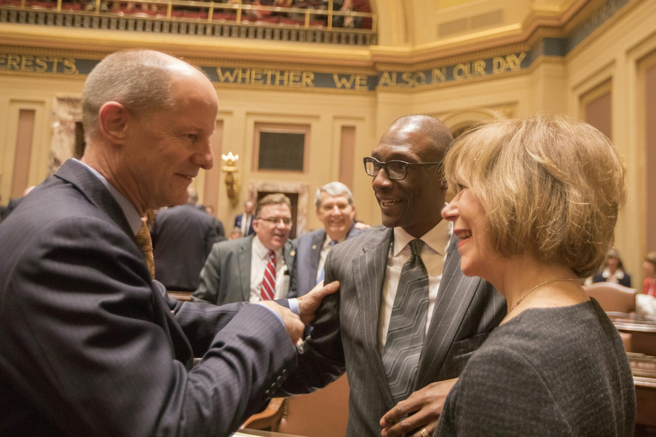 Senate Majority Leader Paul Gazelka, from left, Sen. Bobby Joe Champion, DFL-Minneapolis, and Lt. Governor Tina Smith talk before the session in the Minnesota Senate chambers.