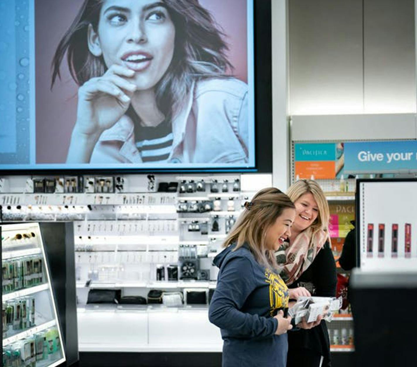 Maria Almoite, left, and Christina Pace, right, shop the newly-remodeled Beauty section in the Target store in downtown Minneapolis. (Glen Stubbe/Minneapolis Star Tribune/TNS) ORG XMIT: 1277955