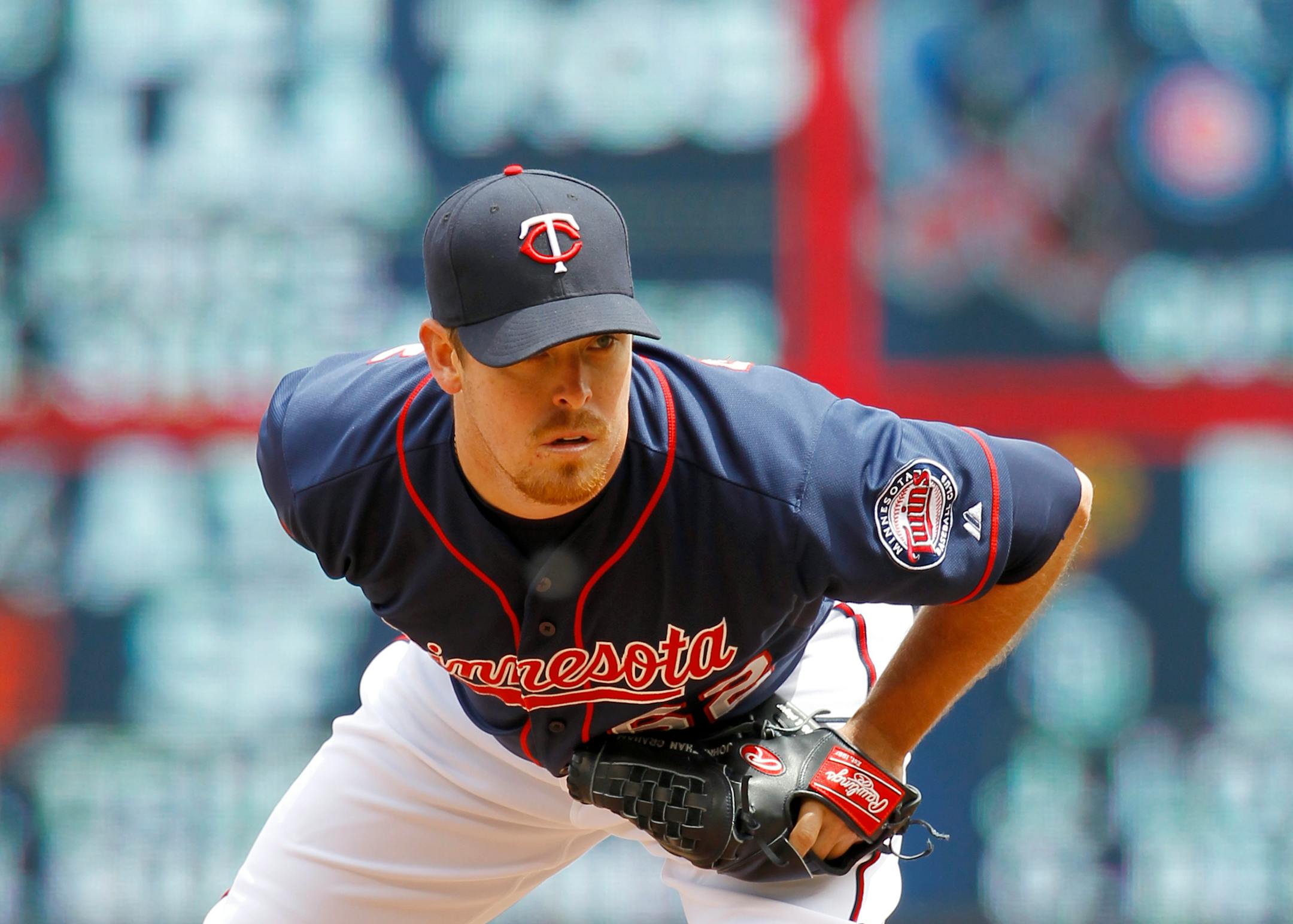 Minnesota Twins relief pitcher J.R. Graham looks for the sign during the second inning of a baseball game against the Toronto Blue Jays in Minneapolis, Sunday, May 31, 2015. (AP Photo/Ann Heisenfelt)