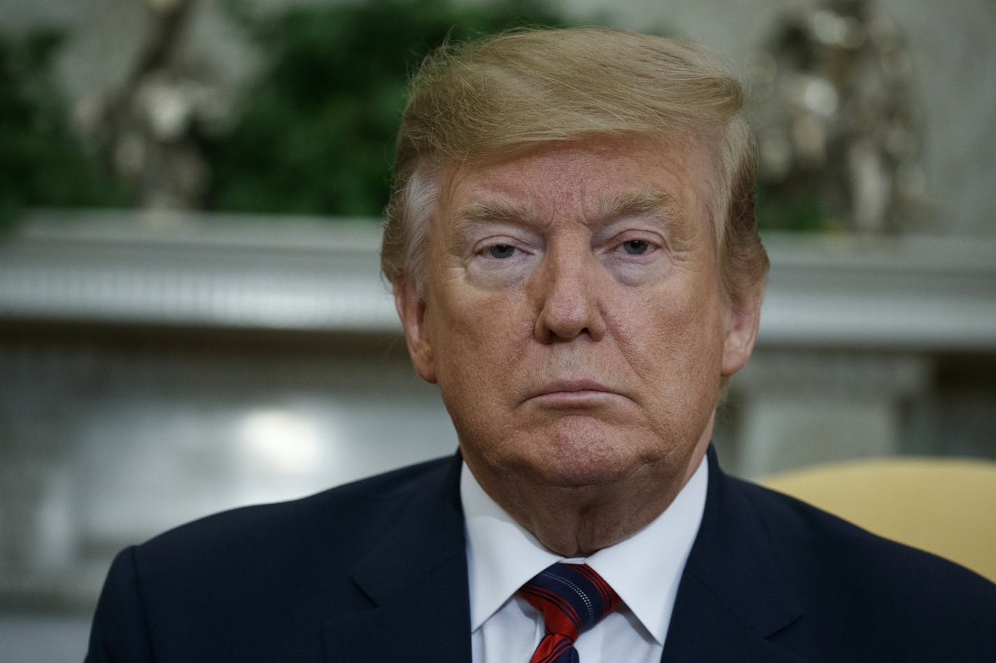 President Donald Trump listens to South Korean President Moon Jae-in speak during a meeting in the Oval Office of the White House, Thursday, April 11, 2019, in Washington. (AP Photo/Evan Vucci)