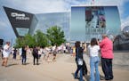 Fans wait for doors to open for the first of two Taylor Swift concerts during the Eras Tour outside U.S. Bank Stadium in Minneapolis, Minn., on Friday