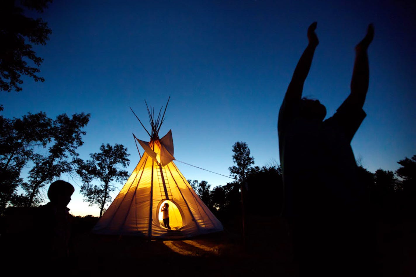 Children enjoy catching fireflies at Blue Mounds State Park.