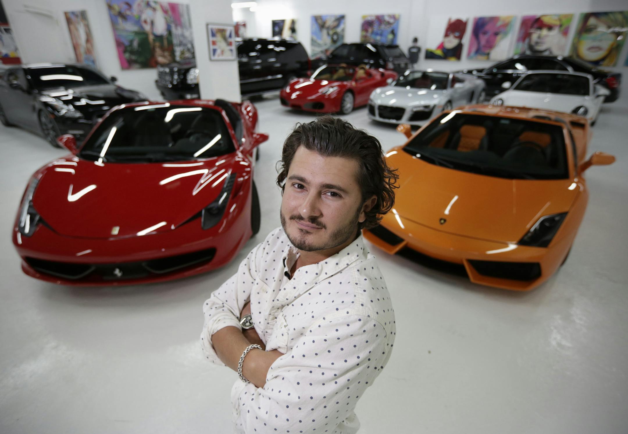 John Temerian, pictured April 23, 2013, is president of Lou La Vie luxury car rentals at 1444 Biscayne Blvd in Miami, Florida. They rent luxury cars such as the Ferrari 458 Spider at left, which goes for $2,850 per day. (Chuck Fadely/Miami Herald/MCT) ORG XMIT: 1138894