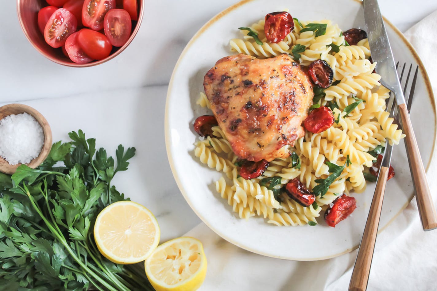 Pan-Roasted Chicken Thighs with Blistered Tomatoes make quick work out of dinner. Recipe by Beth Dooley, Photo by Ashley Moyna Schwickert, Special to the Star Tribune.