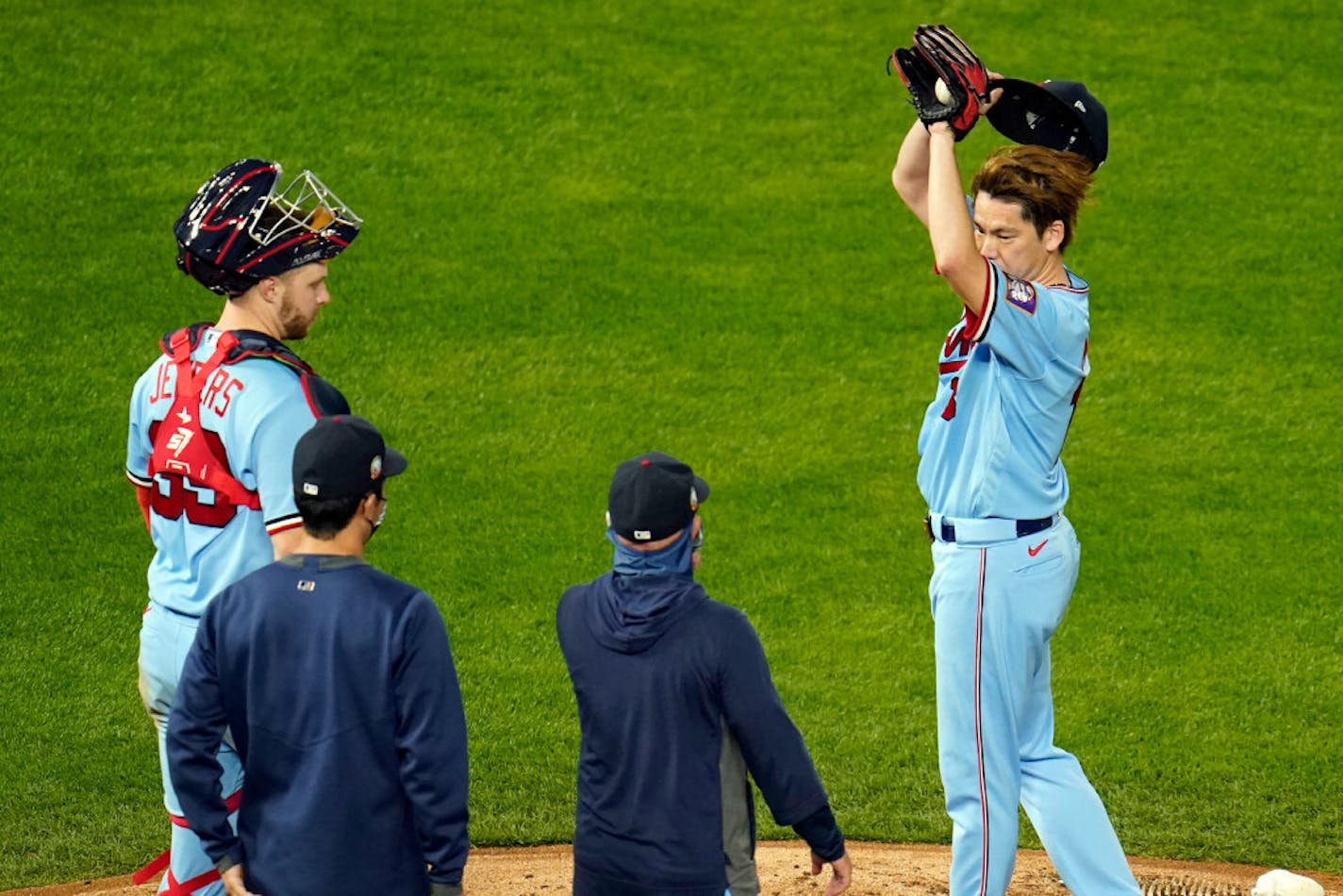 Twins pitcher Kenta Maeda wiped his brow during a conference at the pitcher's mound on Wednesday.