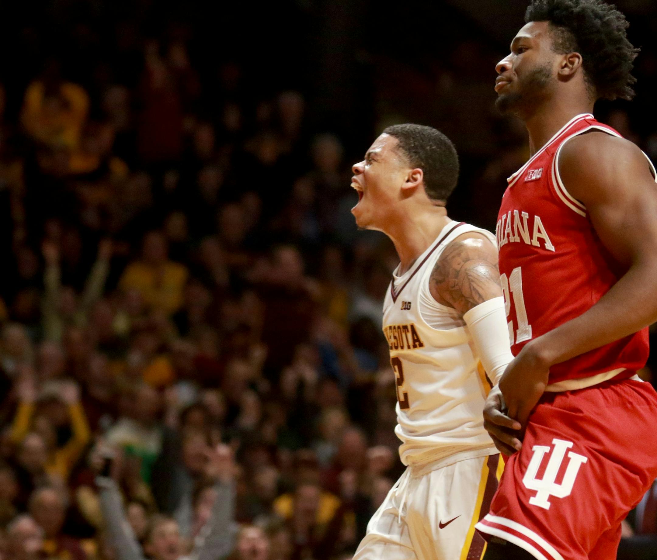The University of Minnesota's Nate Mason (2) erupts during the second half after hitting a three point shot over the University of Indiana's Josh Newkirk (2) during Indiana's 75-71 win over the Gophers at Williams Arena Saturday, Jan. 6, 2018, in Minneapolis, MN.