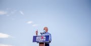 FILE -- Joe Biden, the Democratic presidential nominee, addresses a drive-in campaign event at Southeast Career Technical Academy in Las Vegas, Oct. 9