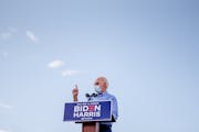 FILE -- Joe Biden, the Democratic presidential nominee, addresses a drive-in campaign event at Southeast Career Technical Academy in Las Vegas, Oct. 9