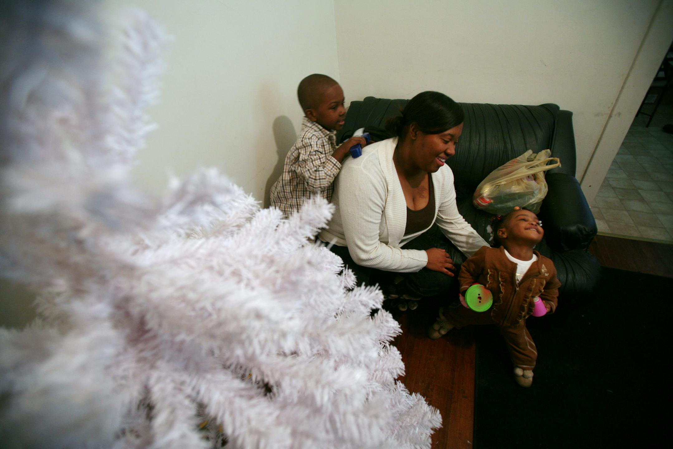 Chatel Chase was reunited Thursday morning with her two children: 4-year-old Aaron Owens and Lydera Owens, 20 months. Chase had a Christmas tree waiting for them in their duplex in St. Paul. The children had been in protective custody since Aaron wandered off three weeks ago.