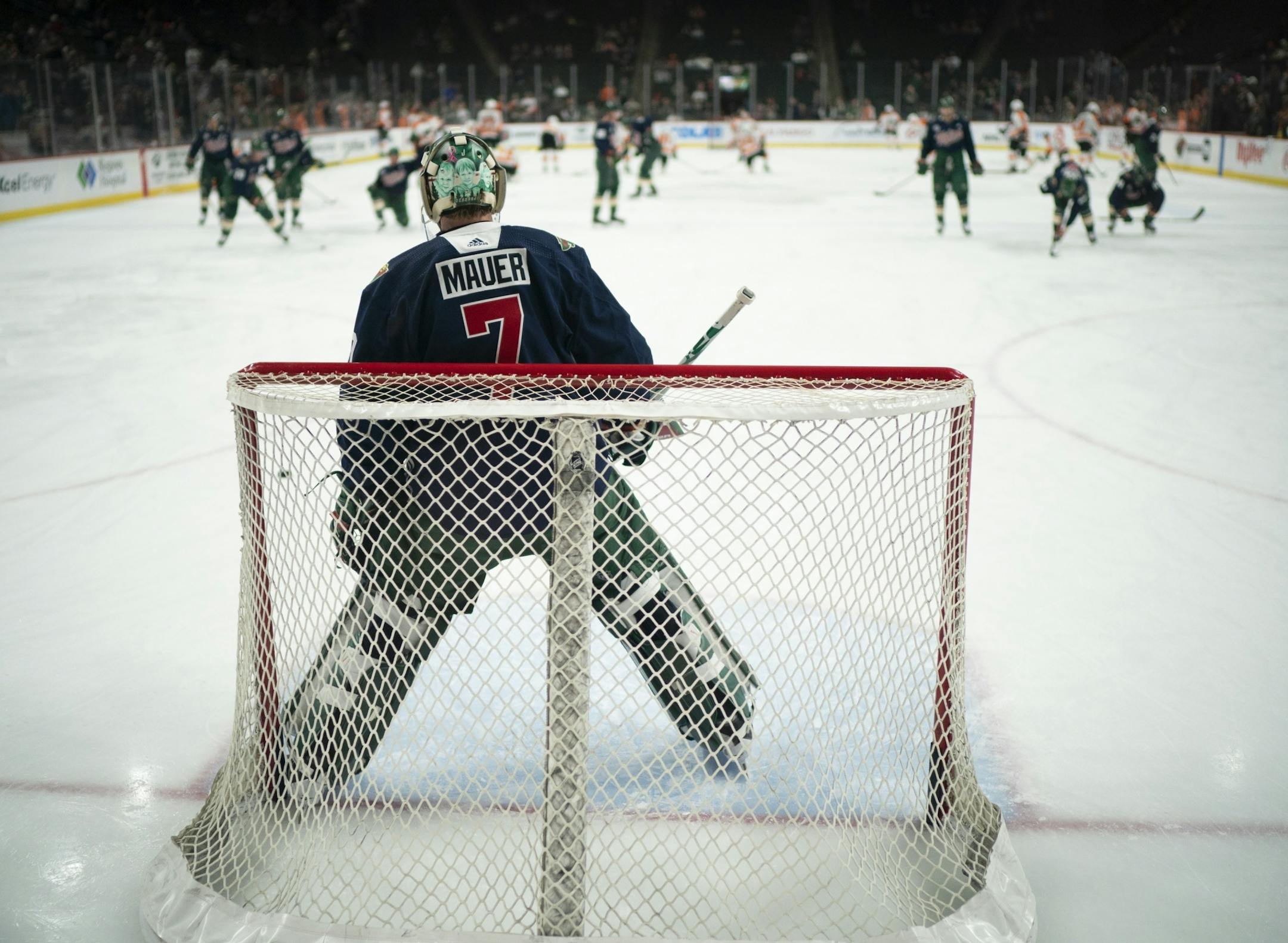 Minnesota Wild goaltender Devan Dubnyk (40) and the rest of the team wore Joe Mauer tribute sweaters during their pregame warmups Tuesday night.