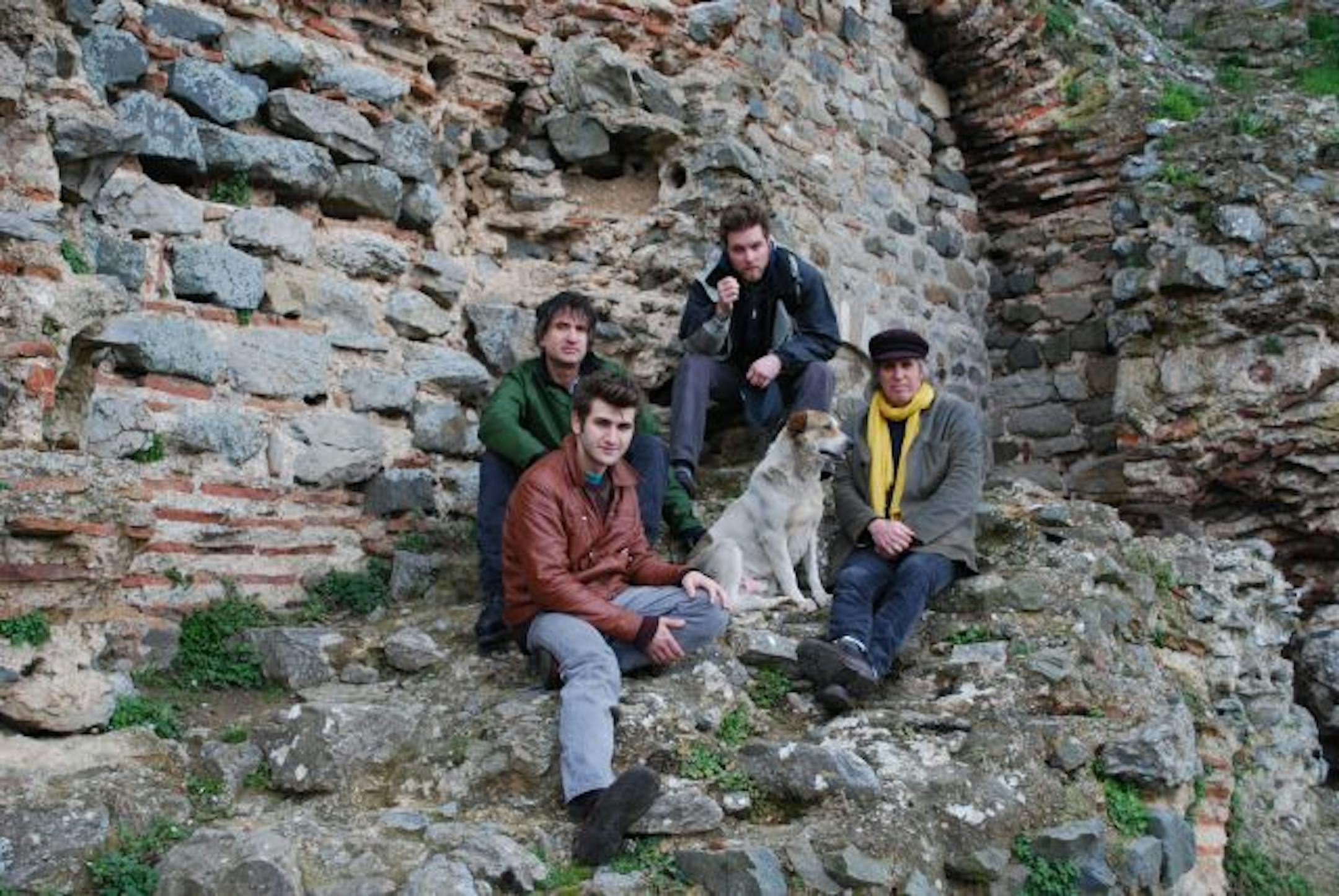 Cafe Maude owner Kevin Sheehy, in the yellow scarf, conspired with Patrick Harison, front, Johnny Michaels, back left, and Aaron Slavicek, top, for the upcoming Istanbul Night.