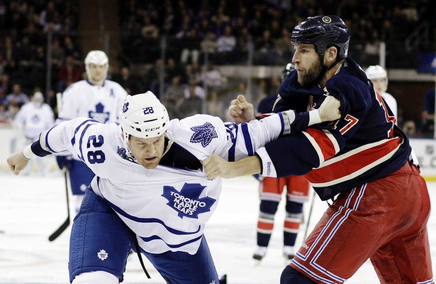 The Wild traded Darroll Powe and minor-leaguer Nick Palmieri to the New York Rangers for rugged veteran forward Mike Rupp (right).