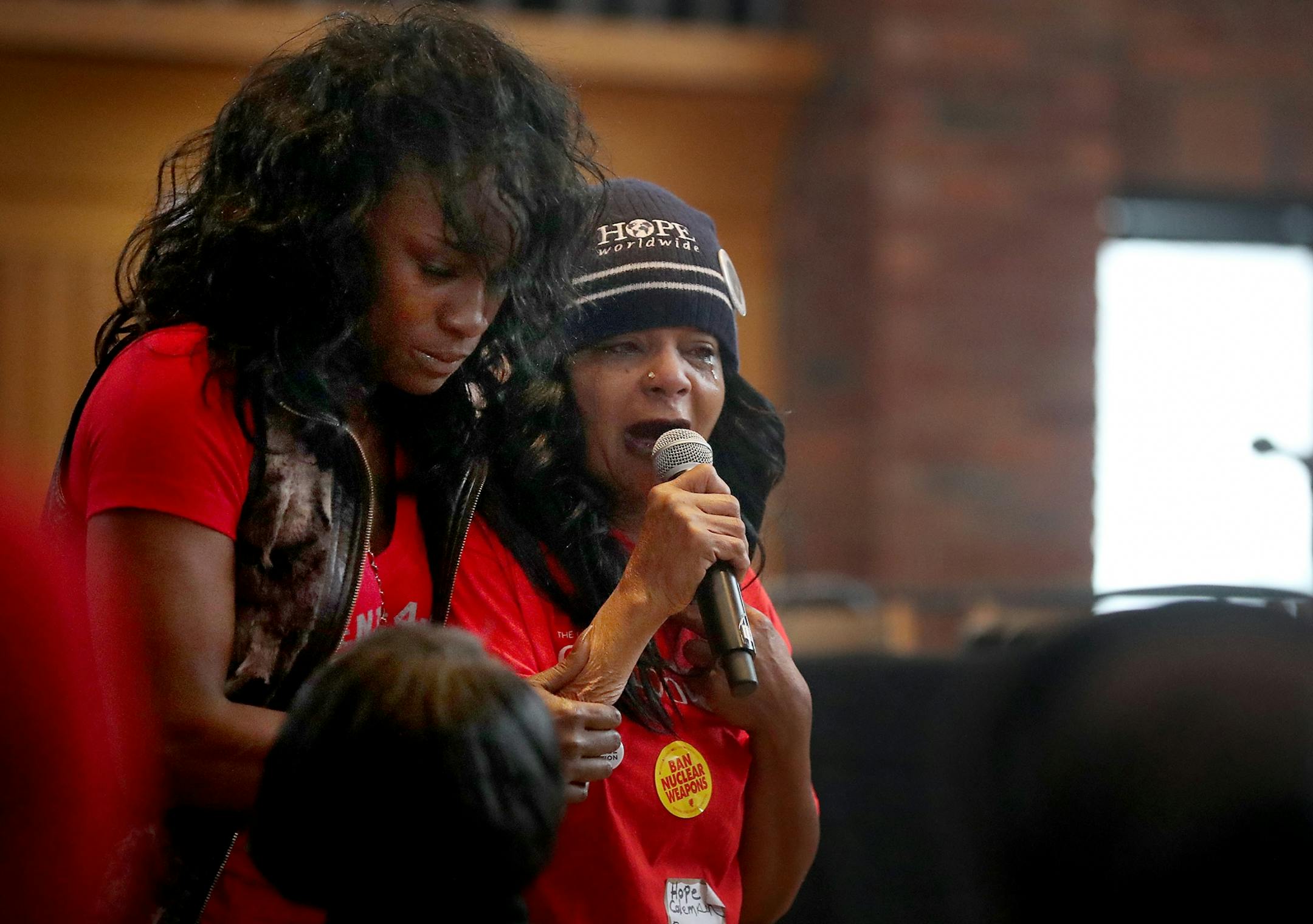 Here, Hope Coleman of Boston, MA, whose son Terrance was shot and killed by police in 2016, tells those gathered about the pain of losing her son while Chantel Brooks, left, whose son Michael Wesley was killed by police in 2013 comforts her during the Take A Knee Nation conference at Foss Center at Augsburg University Saturday, Feb. 3, 2018, in Minneapolis, MN. "I'm suffering in pain," Coleman said. "I lost 80 pounds."