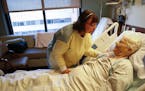 Champlain Wendy Manuel chatted with patient Marcene Johnson's after she messaged her hands in her hospital room at Methodist Hospital in St. Louis Par