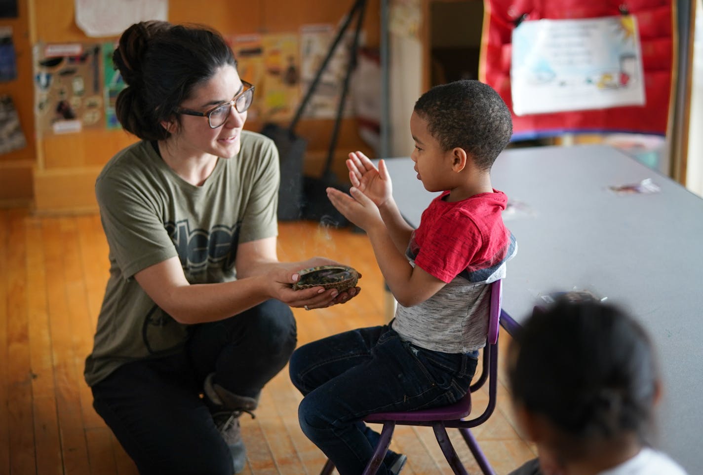 Ojibwe teacher Liz Zoongwegiizhigook Zinsli smudges with students each day. It helps them clear their mind, calm themselves down and prepare for learning. The Ojibwe immersion class is for students from 18 months to 5 years old, at Four Directions school.