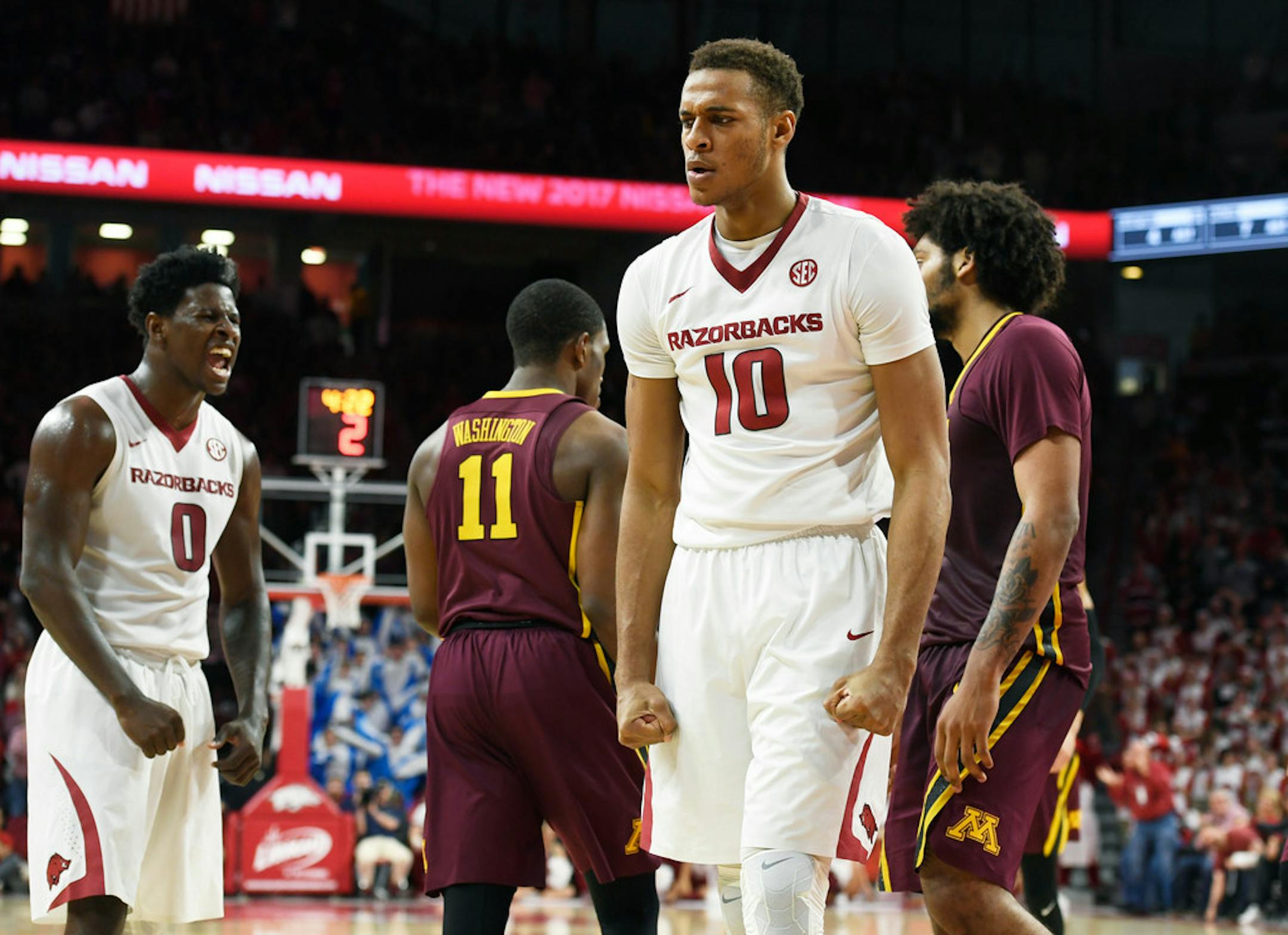 Arkansas' Jaylen Barford (0) and Daniel Gafford (10) react after a call during the second half of an NCAA college basketball game against Minnesota on Saturday, Dec. 9, 2017, in Fayetteville, Ark. (AP Photo/Michael Woods) Jaylen Barford, Daniel Gafford