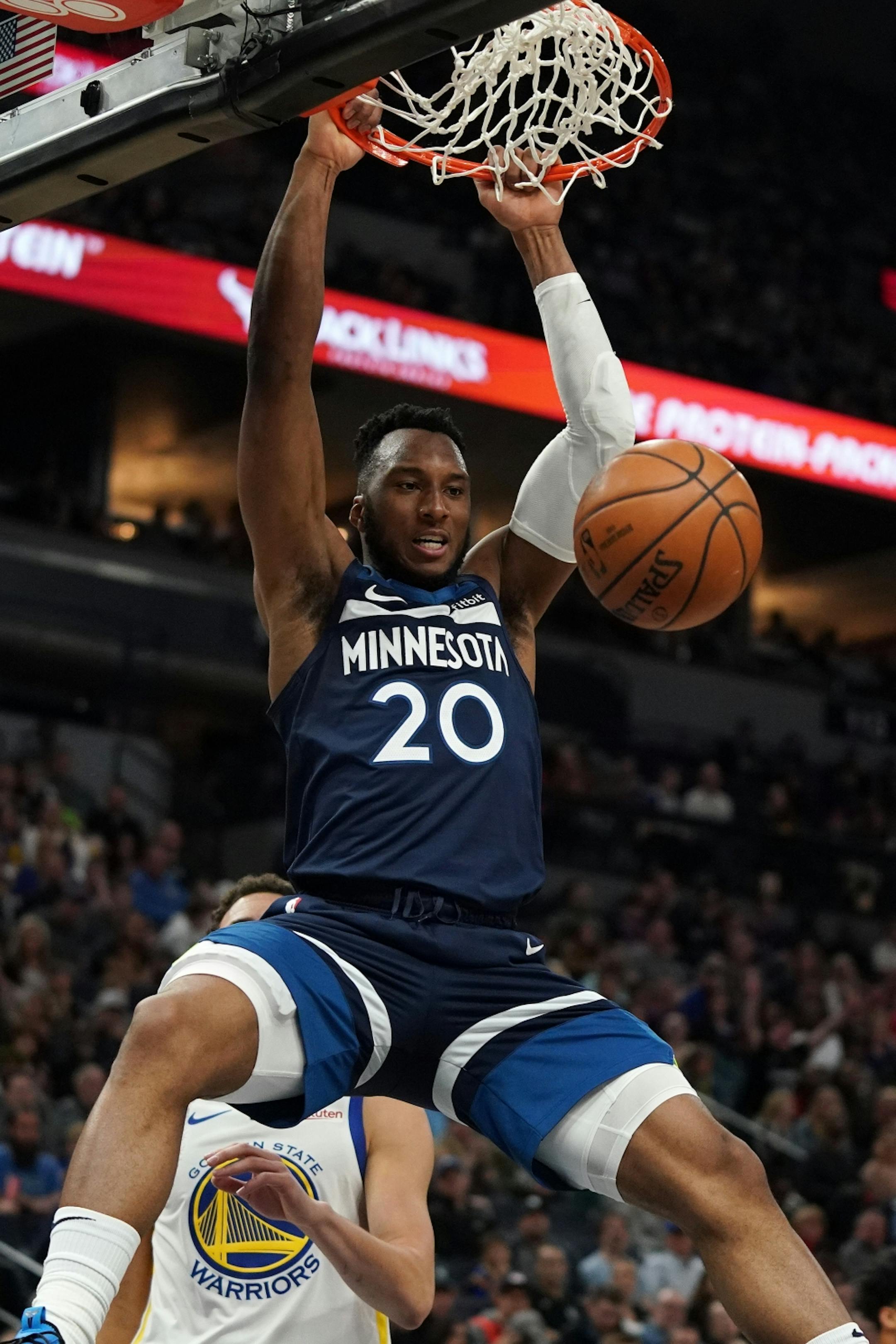 Minnesota Timberwolves guard Josh Okogie (20) dunked the ball in the first half.