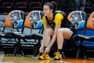 Iowa's Caitlin Clark ties her shoe during a practice for an NCAA Women's Final Four semifinal basketball game Thursday.
