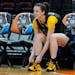 Iowa's Caitlin Clark ties her shoe during a practice for an NCAA Women's Final Four semifinal basketball game Thursday.