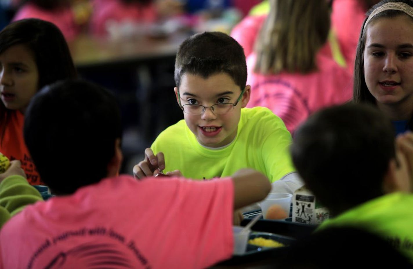 Jarrett Michie, 10, talks with one of his classmates during lunch at Diamond Path School in Apple Valley, MN on January 23, 2013.