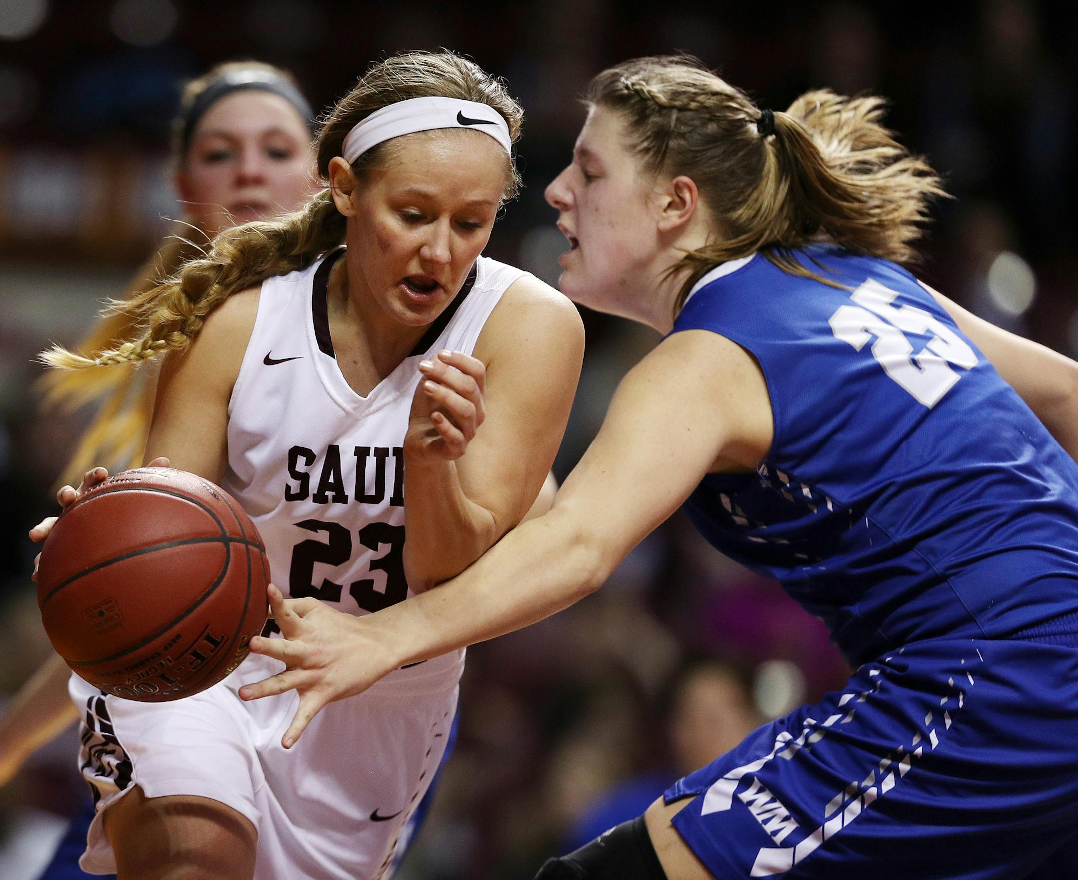 Sauk Centre's Maesyn Thiesen (23) dribbled the ball around Watertown-Mayer's Monika Czinano (25) in the second half. ] ANTHONY SOUFFLE ï anthony.souffle@startribune.com Players competed during the girls' basketball state tournament Class 2A semifinal games Friday, March 17, 2017 at Williams Arena on the grounds of the University of Minnesota in Minneapolis.