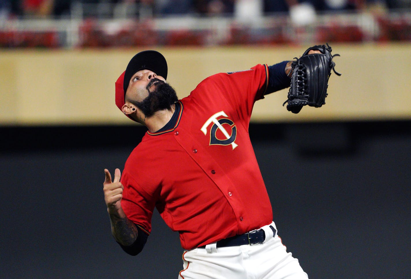 Twins pitcher Sergio Romo celebrated the final out, giving the Twins a 11-9 victory over the Royals.