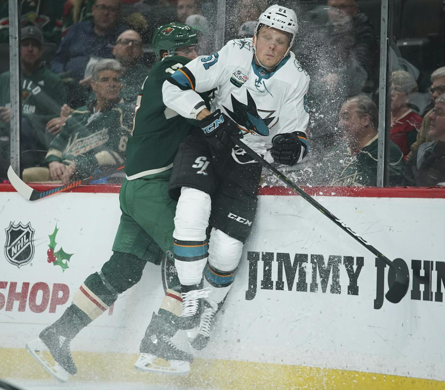 Minnesota Wild left wing Marcus Foligno (17) checked San Jose Sharks defenseman Radim Simek (51) into the boards in the first period. ] JEFF WHEELER &#xef; jeff.wheeler@startribune.com The Minnesota Wild faced the San Jose Sharks in an NHL hockey game Tuesday night, December 18, 2018 at Xcel Energy Center in in St. Paul.