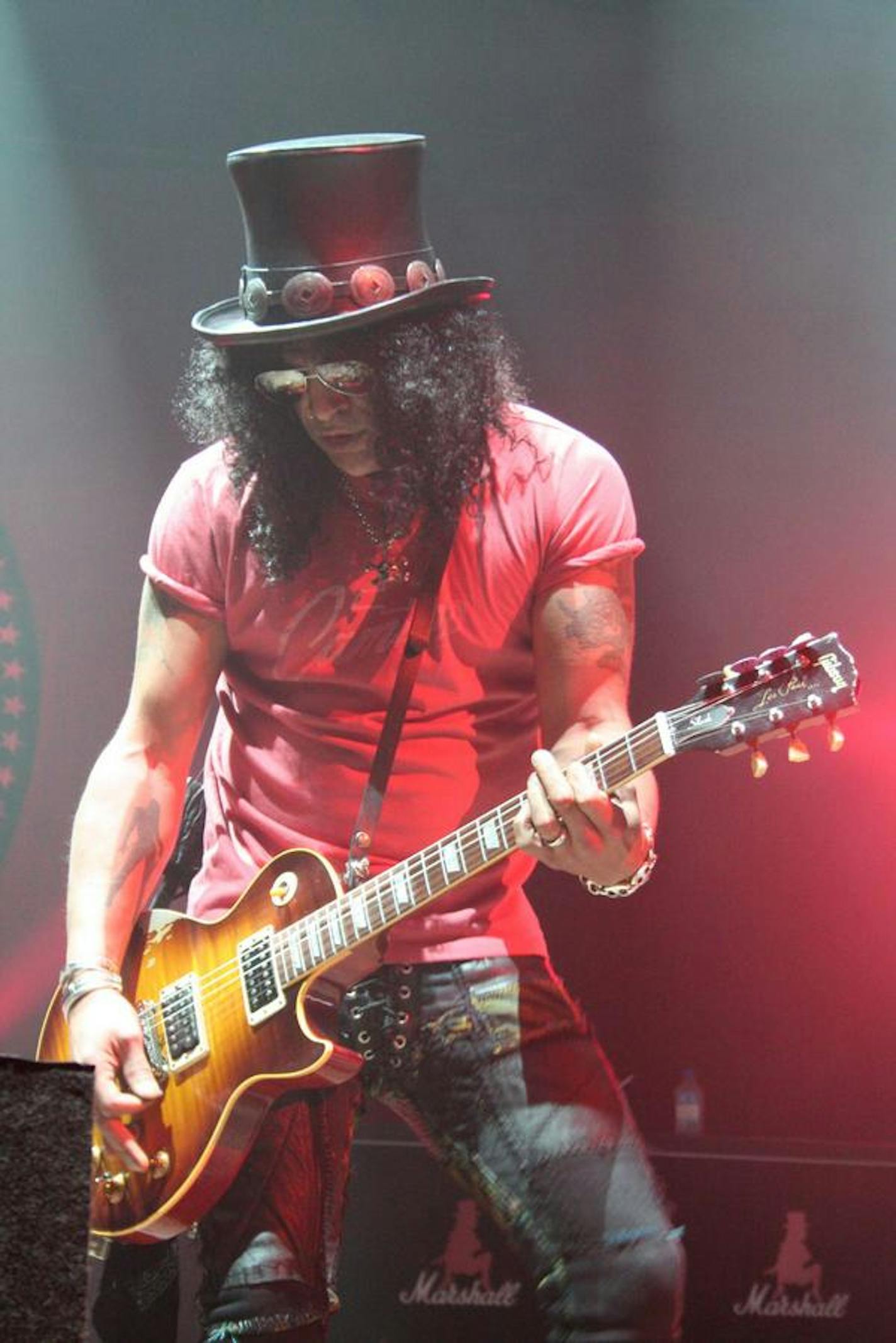 Slash with his shirt on at a prior show. / Courtesy Slashonline.com.