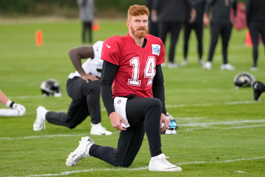 Saints quarterback Andy Dalton during practice at the London Irish rugby team training ground in Sunbury-on-Thames near London on Wednesday. Saints left for England on Monday. 