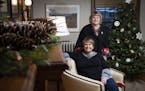Liz Knutson, seated, and her sister Kathy Keehn in Knutson's Minneapolis home, which they decorated for the holidays. The designing sisters are partne