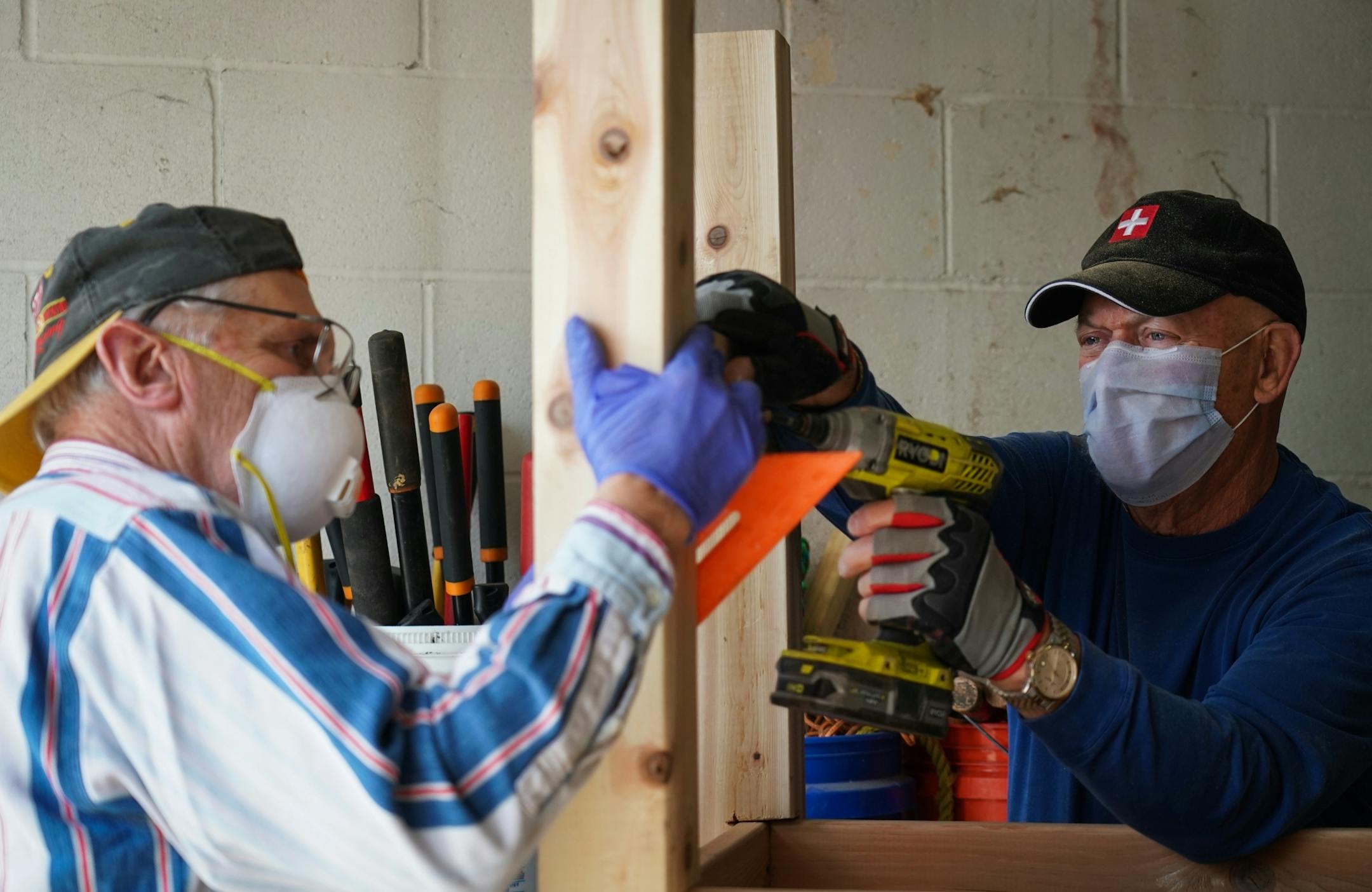 Volunteers with Rebuilding Together Twin Cities, a low income housing nonprofit, gathered to build standing planter boxes that will be sold for Mother's Day as a fundraiser. Most of the volunteers building the planter boxes are retired Honeywell employees who are part of the ramp building team that finished their 50th ramp for homeowners last year. Profits from the planter sales will help build more ramps in the future. According to Tony Sjogren, Program Director, the project serves two purposes