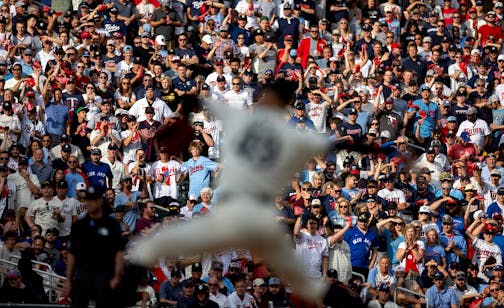 Fans cheer on Minnesota Twins pitcher Pablo Lopez while he throws to a batter with two strikes in the third inning during Game 1 of the Wild Card series, Tuesday, October 3, 2023, at Target Field in Minneapolis, Minn. ] CARLOS GONZALEZ • carlos.gonzalez@startribune.com