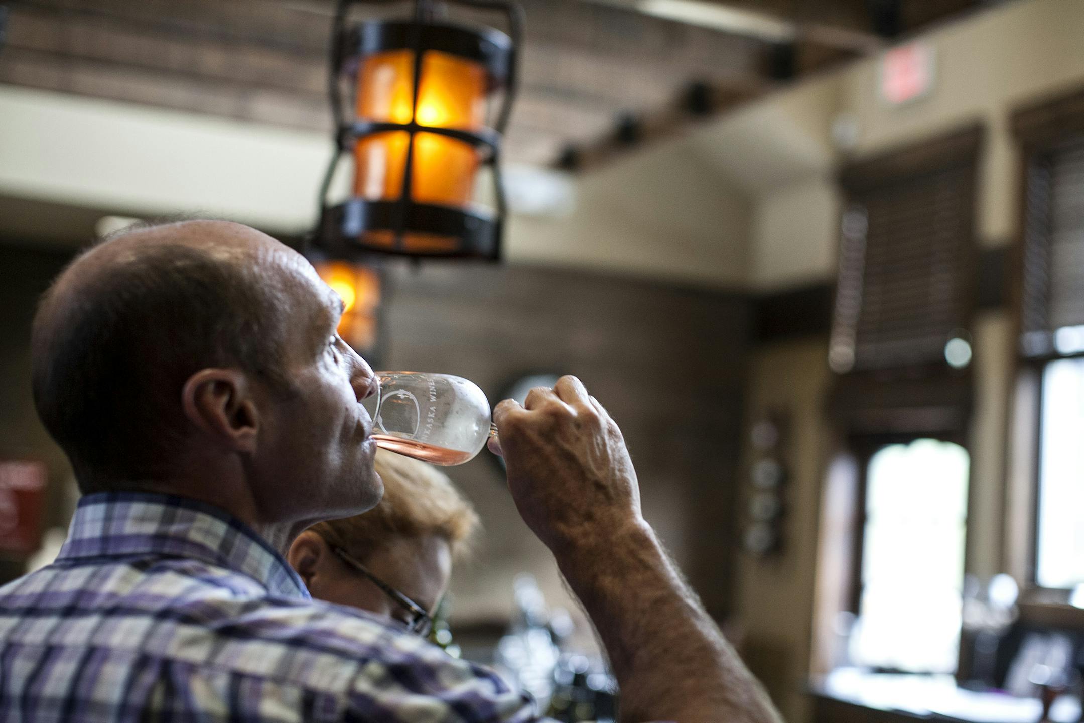 Bret Saathoff of Eagan samples the Kasota Rose wine in the tasting room at Chankaska Creek Ranch and Winery.