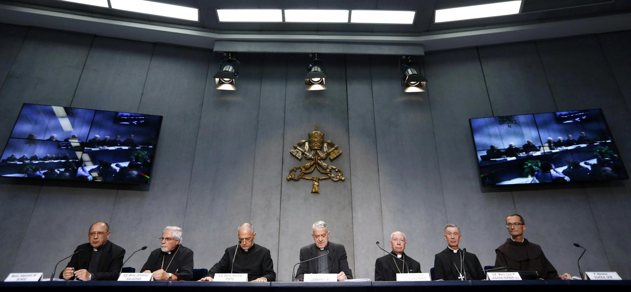 From left, Monsignor Alejandro W. Bunge, Monsignor Dimitrios Salachas, Monsignor Pio Vito Pinto, Vatican spokesperson Father Federico Lombardi, Cardinal Francesco Coccopalmerio, Monsignor Luis Francisco Ladaria Ferrer and Rev. Nikolaus Schoch meet the media to illustrate a new law issued by Pope Francis regulating how bishops around the world determine when a fundamental flaw has made a marriage invalid, at the Vatican, Tuesday, Sept. 8, 2015. Pope Francis radically reformed the Catholic Church'
