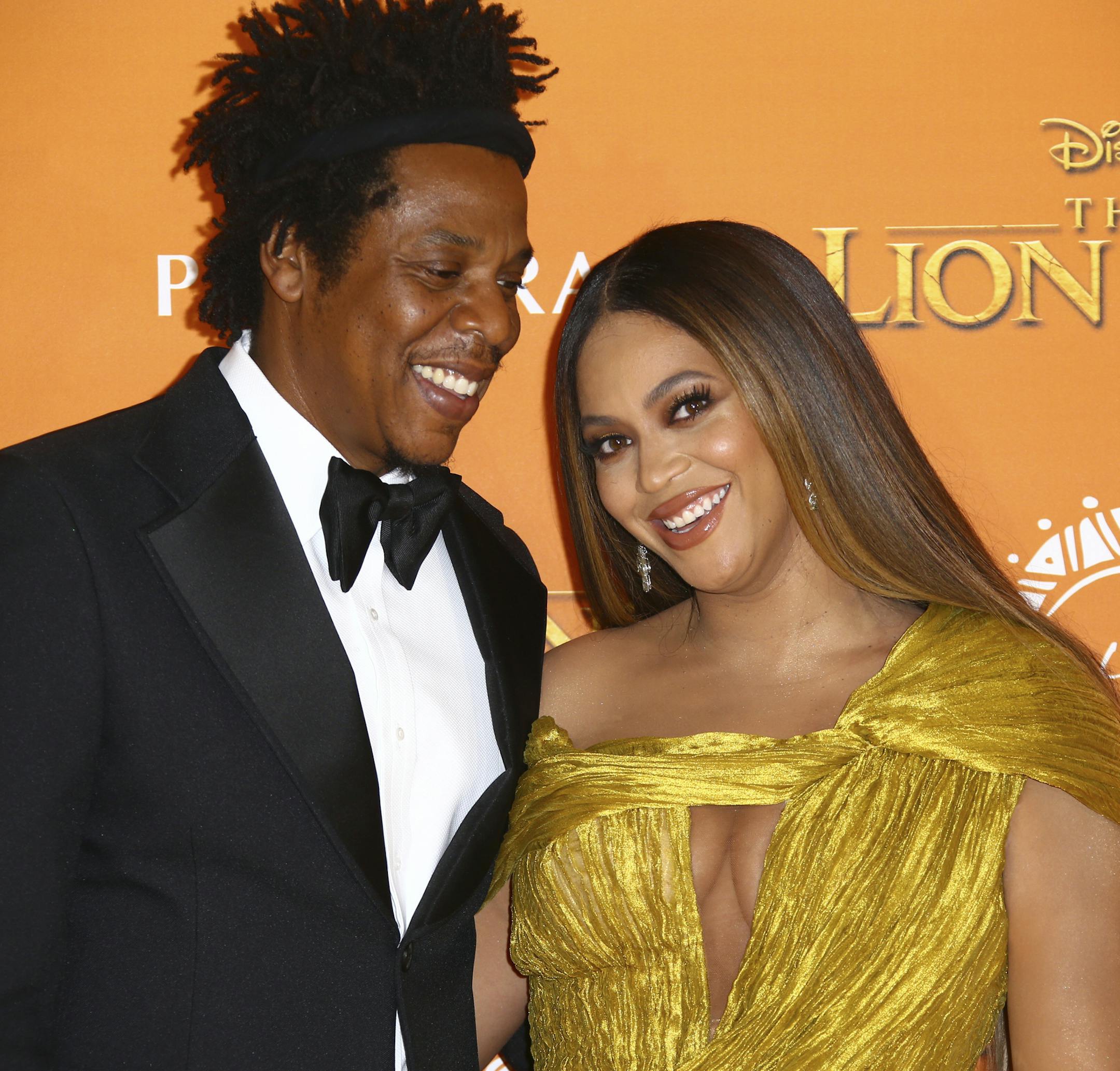 Singers Jay-Z, left, and Beyonce pose for photographers upon arrival at the 'Lion King' European premiere in central London, Sunday, July 14, 2019. (Photo by Joel C Ryan/Invision/AP)