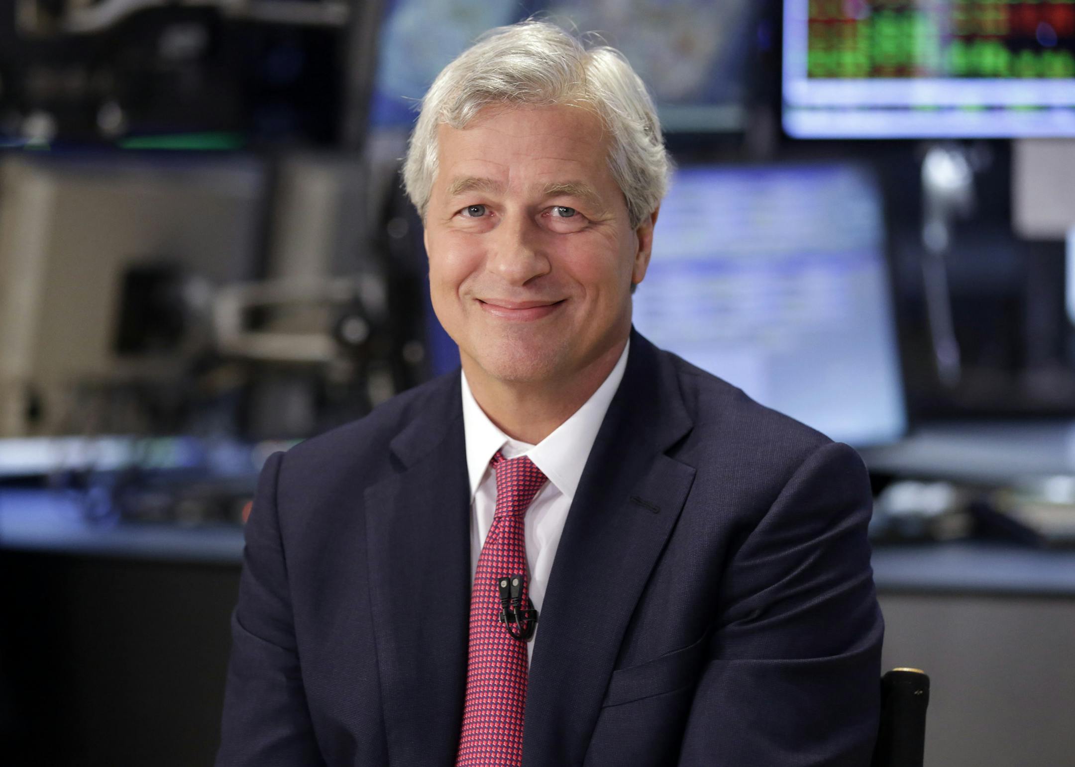 FILE - In this July 12, 2013 file photo, JP Morgan Chase Chairman and CEO Jamie Dimon is interviewed on the floor of the New York Stock Exchange. JPMorgan said Friday, Oct. 25, 2013, that it has agreed to pay $5.1 billion to resolve claims that it misled Fannie Mae and Freddie Mac about risky mortgage securities it sold them before the housing market collapsed. (AP Photo/Richard Drew, File)