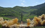 FILE- This photo on July 4, 2017, distributed by the North Korean government shows what was said to be the launch of a Hwasong-14 intercontinental bal